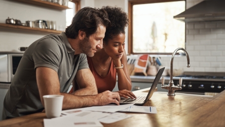 Couple looking at laptop screen