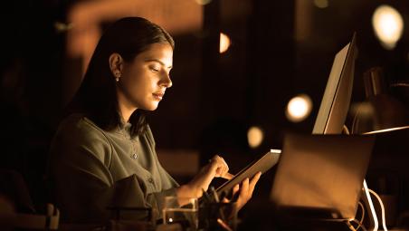 Lady on her tablet looking up information 