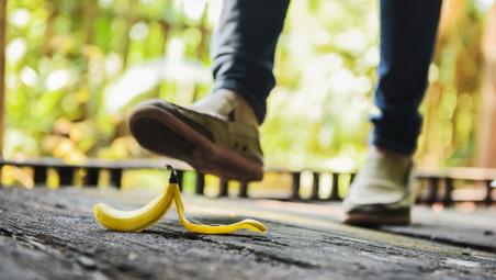 Man about to walk on banana skin