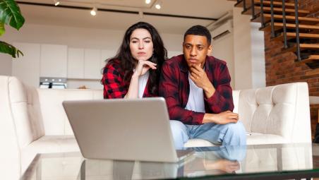 Man and woman looking at banking details