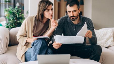 Man and woman looking at finances