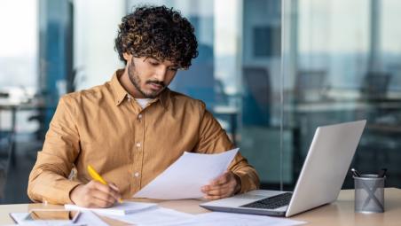 A man looking at his finances online