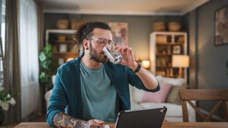 Man on computer choosing products