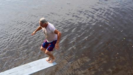 Man about to dive into water