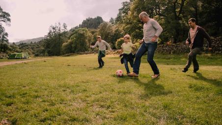 Family playing football