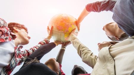 People holding a globe