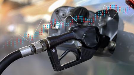 Petrol pump with chart behind it