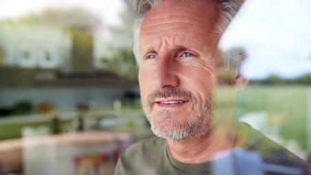 Man looking out of window