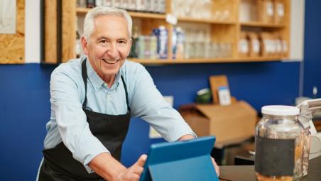 Senior man working in a shop