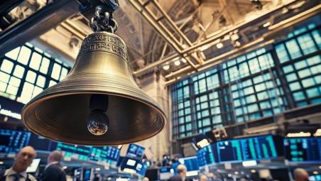 Bell against a stock market backdrop