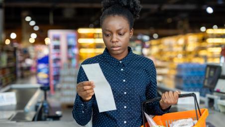 Woman checking her receipt after shopping