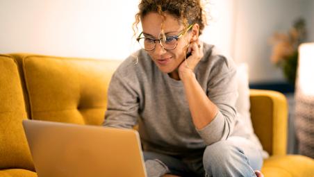 A woman looking at a computer screen