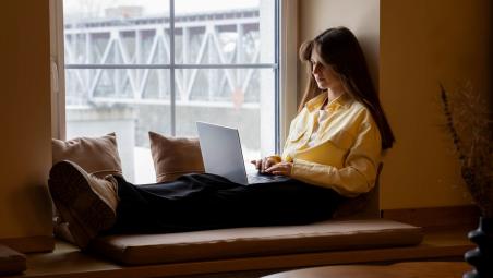 Woman looking at laptop