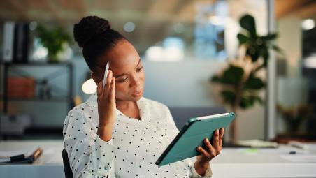 Woman reading tablet