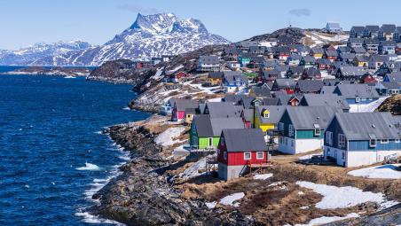 colourful houses along coastline in greenland