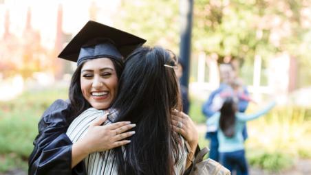 daughter hugging mother at graduation