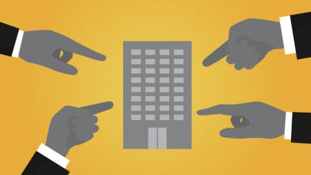 hands pointing at a building