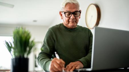 man using laptop at home