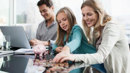mother and daughter counting coins