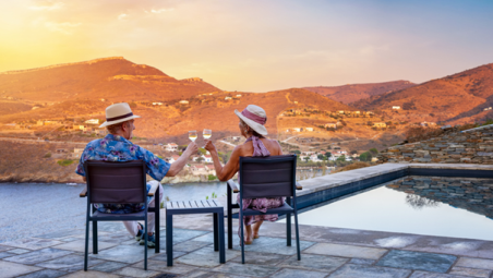 Elderly couple drinking wine on holiday