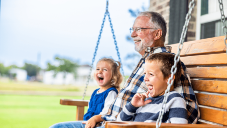 Retired man sat with grandkids