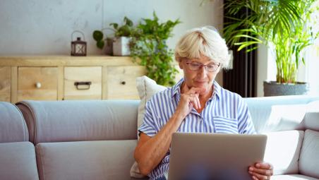 senior woman using laptop at home