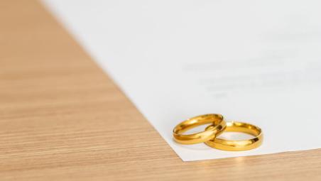 two gold rings on table
