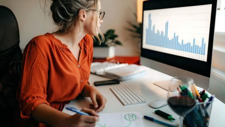 woman doing research on computer