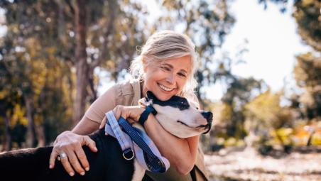 woman hugging a dog