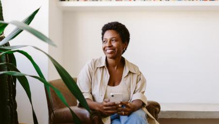 woman smiling on sofa in living room