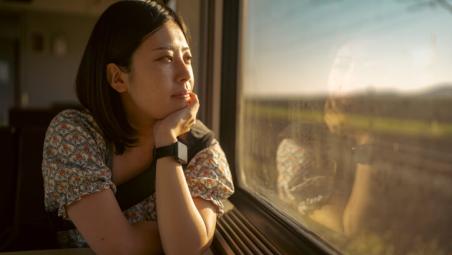 woman thinking on train