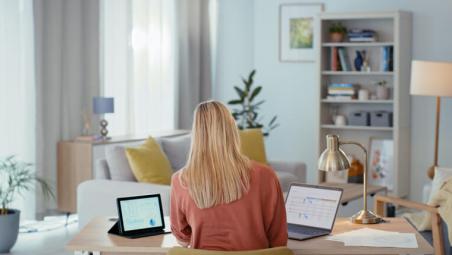 woman using laptop in her living room