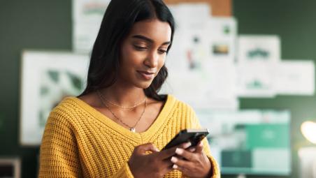 woman using smartphone at home
