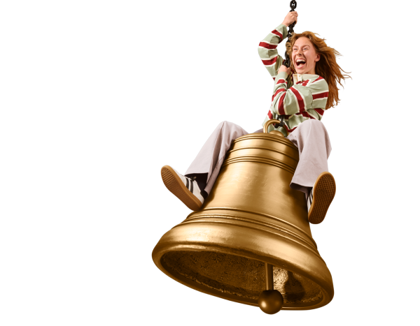 Women swinging a wrecking ball shaped like a bell